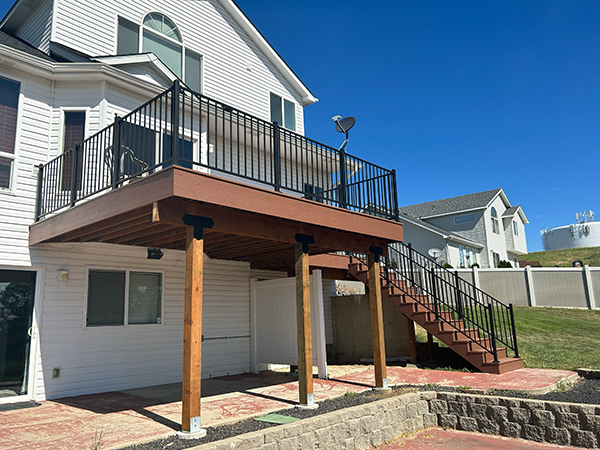 Newly built deck designed to elevate backyard living, seamlessly attached to the home for style and function.