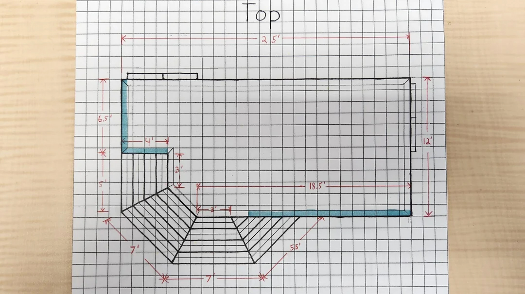 Top view of a deck design sketch on graph paper with dimensions and handrail plans.