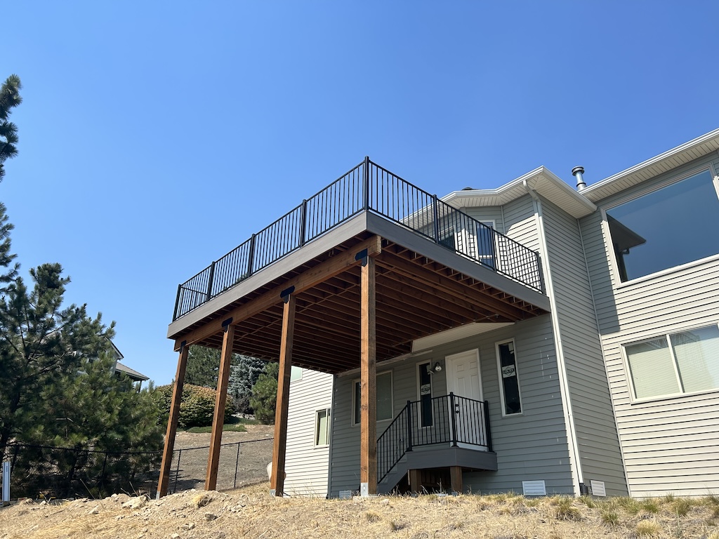 Large elevated deck providing stunning backyard views.