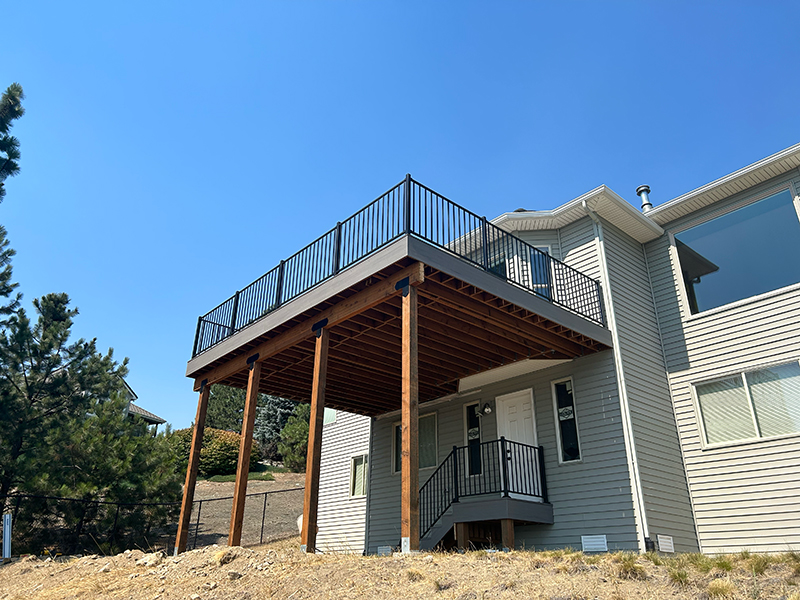 Large elevated deck providing stunning backyard views.