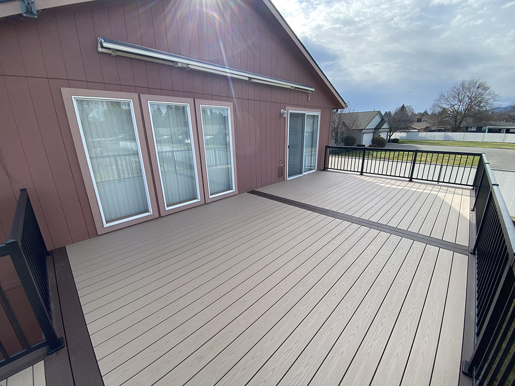 Modern back deck with a composite border in the middle.
