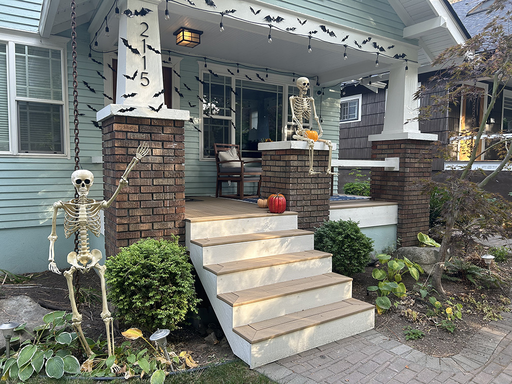 Beautiful front porch on an older home during Halloween.
