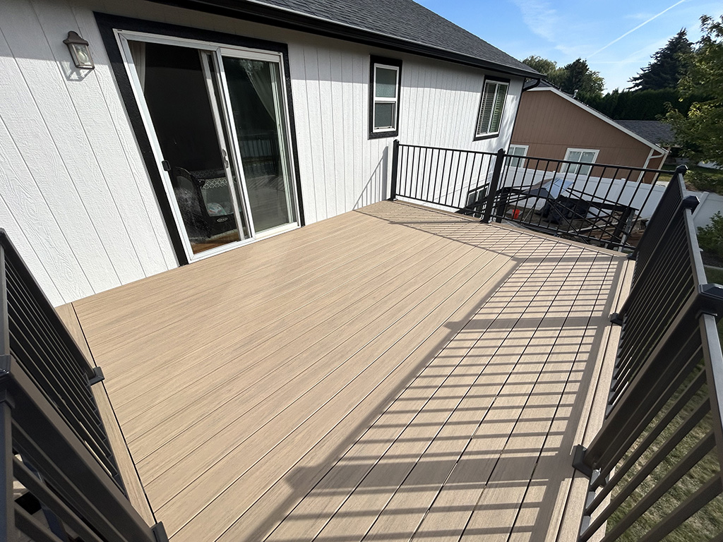 New back deck seamlessly connected to a modern home.