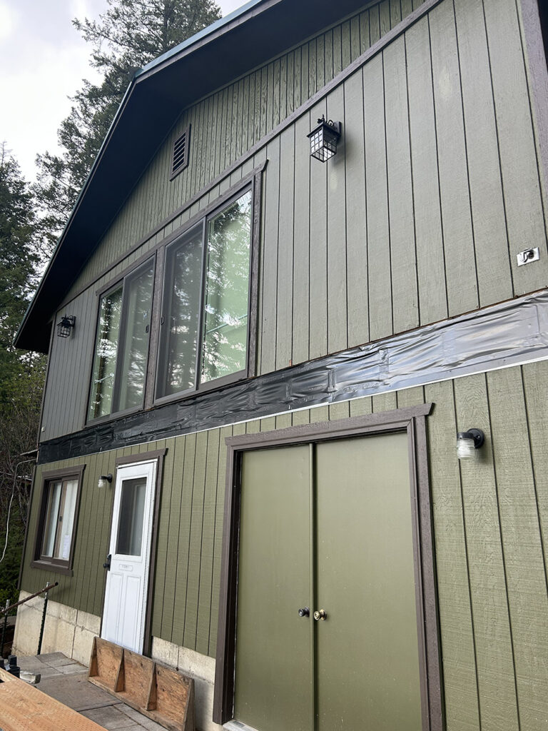House wall with flashing installed before deck build