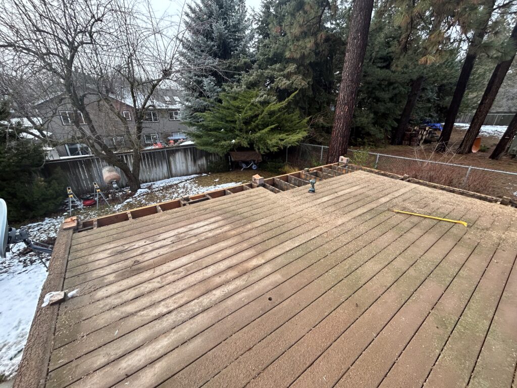 Old Trex deck with mold being torn out