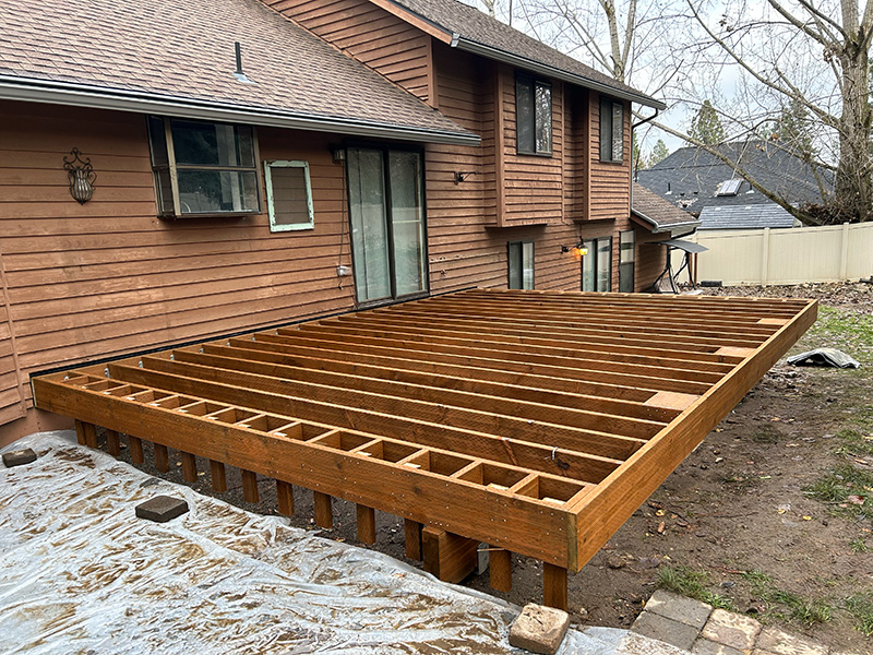 Back deck framing showcasing the use of pressure-treated lumber.