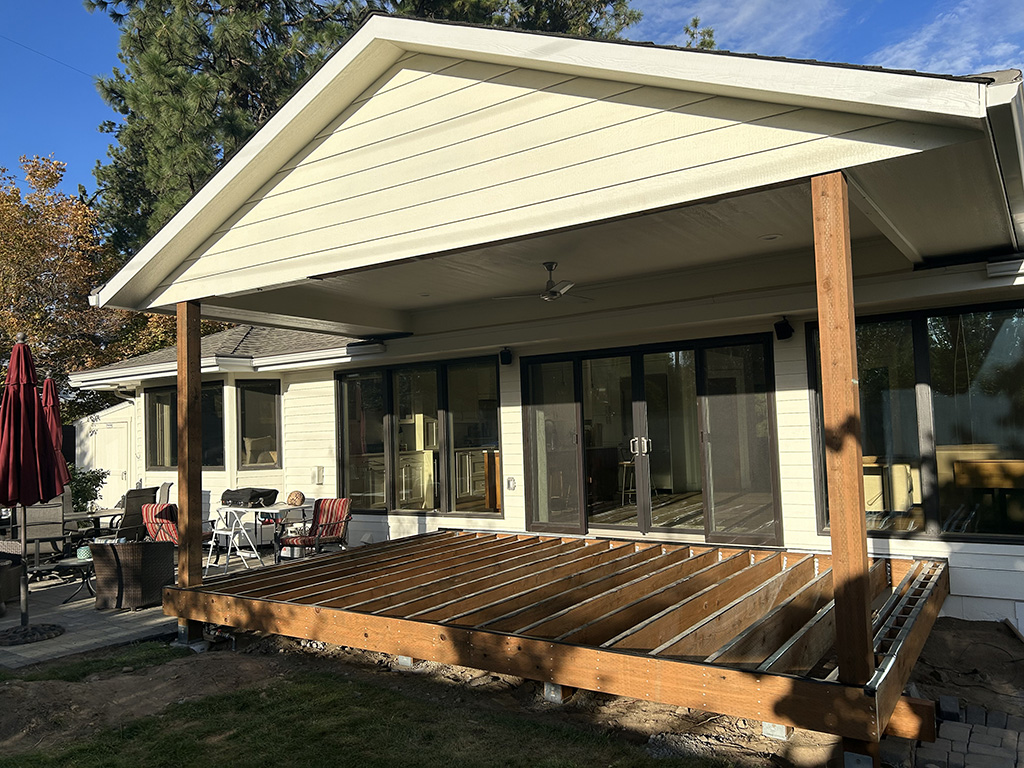 Covered deck framing under roof extension